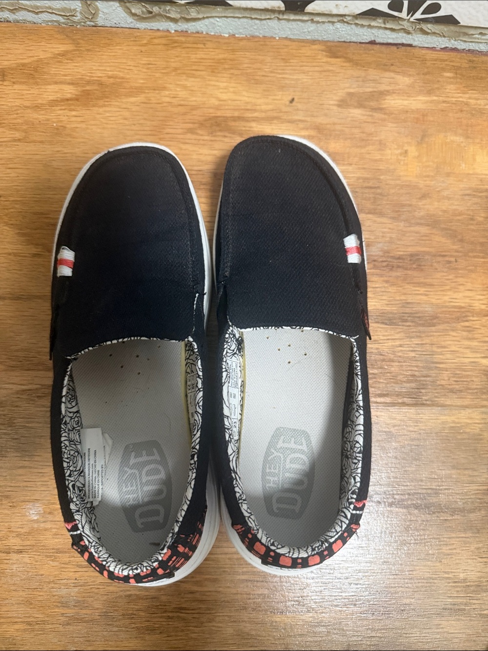 Hey Dude Black Slip-On Sneakers with Red Accent